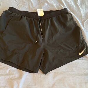 Nike Black Shorts with Gold Logo